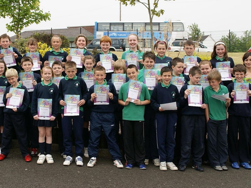 Constable Tony Quinn - PSNI Community Involvement, Waterside - Presenting certificates to Year 7 pupils from St. Colmcille's Primary School, Claudy on completion of a Citizenship and Safety Education Programme of work.Also pictured are school principle Mrs Briege O'Neill and Year 7 teacher Miss Edel McLaughlin.