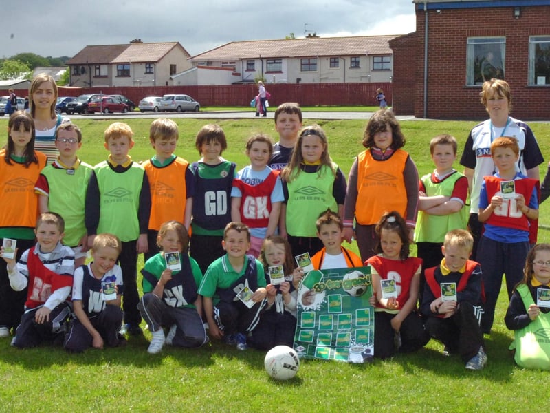 Children from Ebrington Primary School take part in the IFA Green Card programme which aims to build confidence and self esteem thorugh sport. Included are teacher Joanne Donaldson, left, and Patricia, IFA DENI coach. (2205PG11)