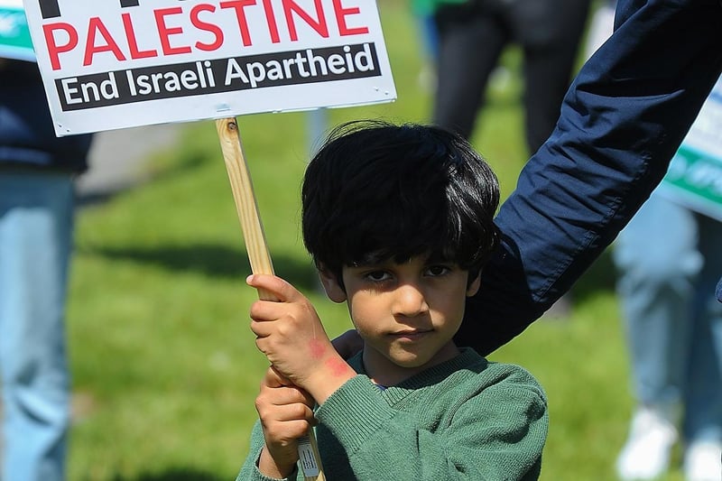 Young protestor at the Palestinian solidarity Rally at Free Derry Wall on Saturday after last. Photo: George Sweeney. DER2120GS – 066