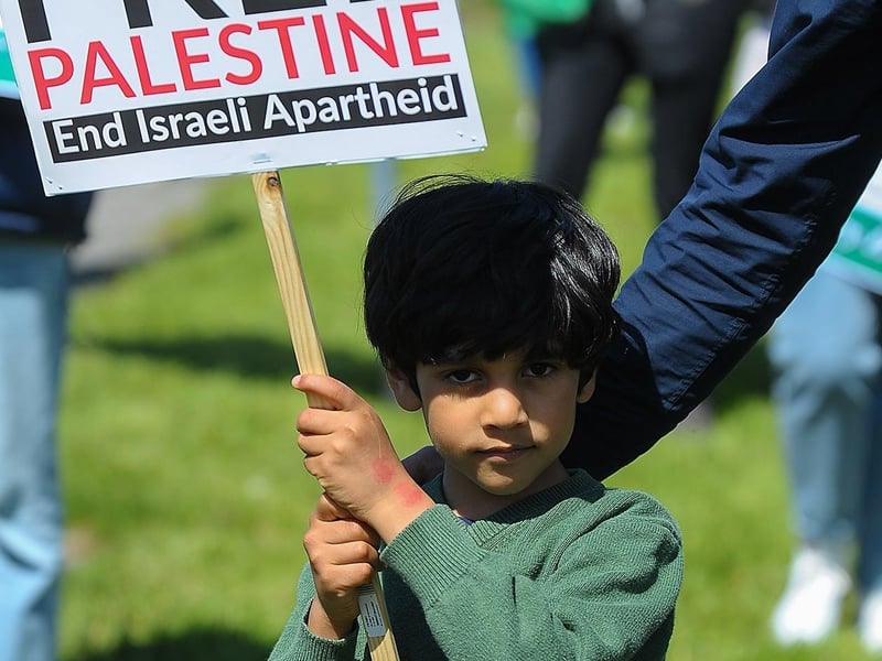 Young protestor at the Palestinian solidarity Rally at Free Derry Wall on Saturday after last. Photo: George Sweeney. DER2120GS – 066