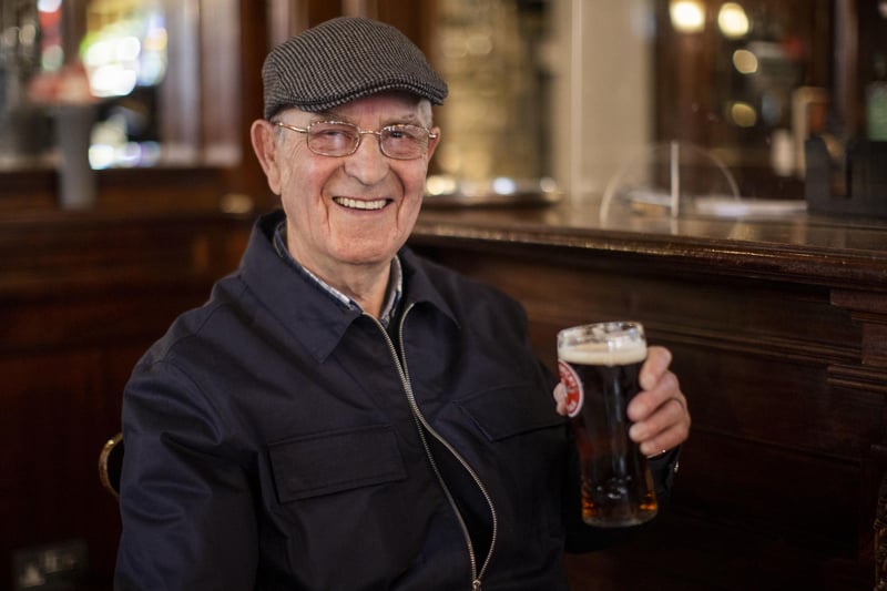 Tommy Brady, 78, enjoying his first pint of Smithwick's Ale since Christmas Eve at The Garrick Bar in Belfast, after the latest easing of the Covid-19 rules in Northern Ireland
