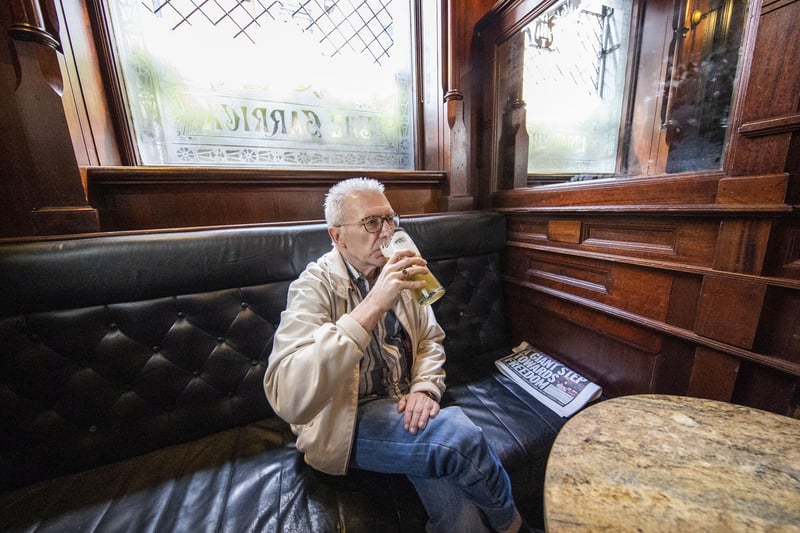 Cliff Giles enjoying his first pint of lager since Christmas Eve at The Garrick Bar in Belfast after the latest easing of the Covid-19 rules in Northern Ireland