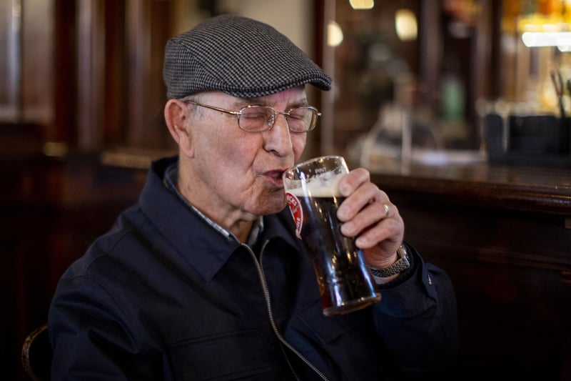 Tommy Brady, 78, enjoying his first pint of Smithwick's Ale since Christmas Eve at The Garrick Bar in Belfast, after the latest easing of the Covid-19 rules in Northern Ireland