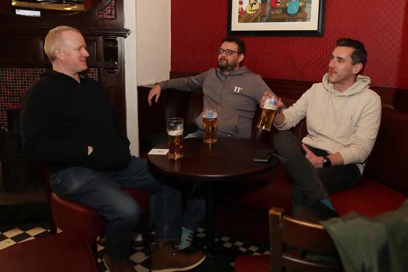 (L-R) David Mooney, Gerrard Barnes and Paul Vernon enjoy a drink in Brennans Bar Belfast.

Belfast City Centre bars were open for business again after the recent lockdown restrictions were lifted.