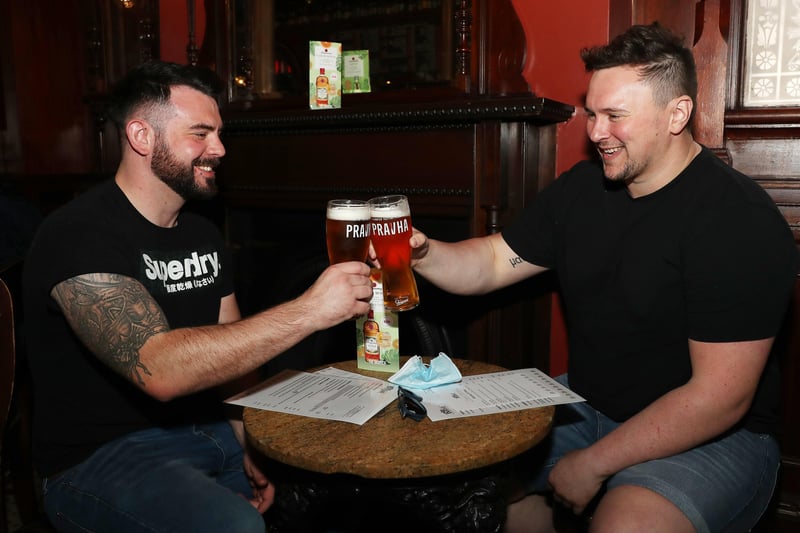 (L-R) Jordan Cinamon and Stephen Ferguson enjoy a drink in the Garrick Bar Belfast.

Belfast City Centre bars were open for business again after the recent lockdown restrictions were lifted.