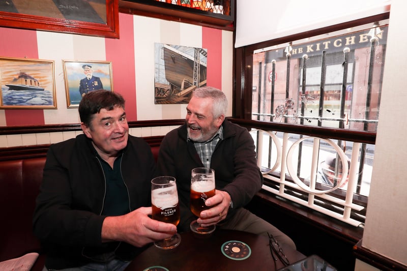 Brother Joe and Larry Rainey enjoy a pint inside Bittles Bar in Belfast City Centre. 

Picture by Jonathan Porter/PressEye