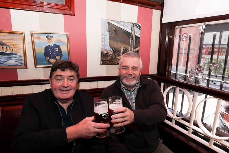 Brother Joe and Larry Rainey enjoy a pint inside Bittles Bar in Belfast City Centre. 

Picture by Jonathan Porter/PressEye