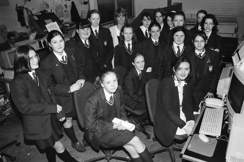 Bernadette Haughey, trainee compositor, with pupils from St. Cecilia’s Secondary School when they visited the Derry Journal offices. Included is Sharon Bergin, teacher.