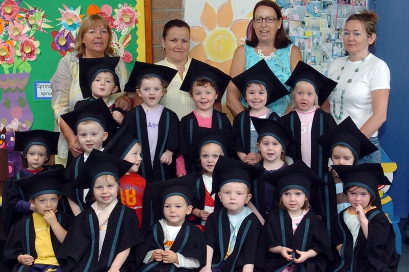 Children and staff from the Chapel Road Playgroup, pictured during their graduation. Included, are staff members, Deirdre Mcdaid, karen McLaughlin, Patricia Glenn and Bernie McCafferty. (2106A04)