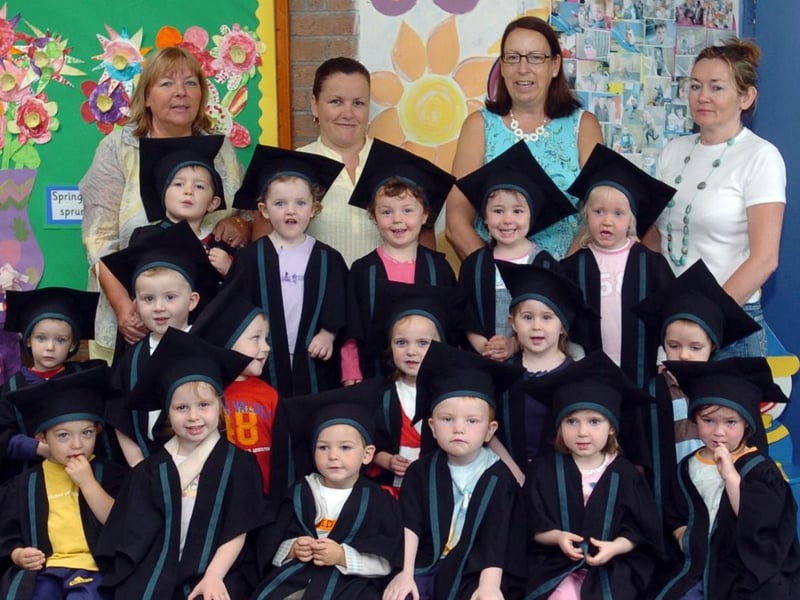 Children and staff from the Chapel Road Playgroup, pictured during their graduation. Included, are staff members, Deirdre Mcdaid, karen McLaughlin, Patricia Glenn and Bernie McCafferty. (2106A04)