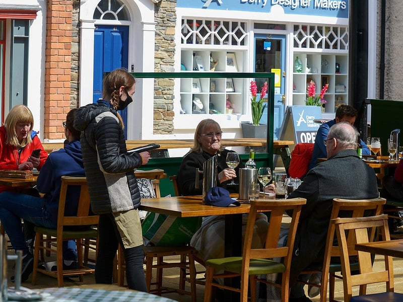 Happy customers dine outdoors in the Craft Village. DER2119GS – 004