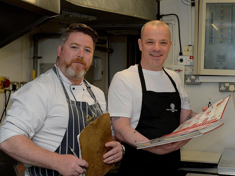 Sooty Olive Chef Micheál McDonald, on the left, and Head Chef / Proprietor Sean Harrigan discuss menus ahead of the hospitality sector reopening for indoor dining. Photo: George Sweeney / Derry Journal. DER2120GS – 013