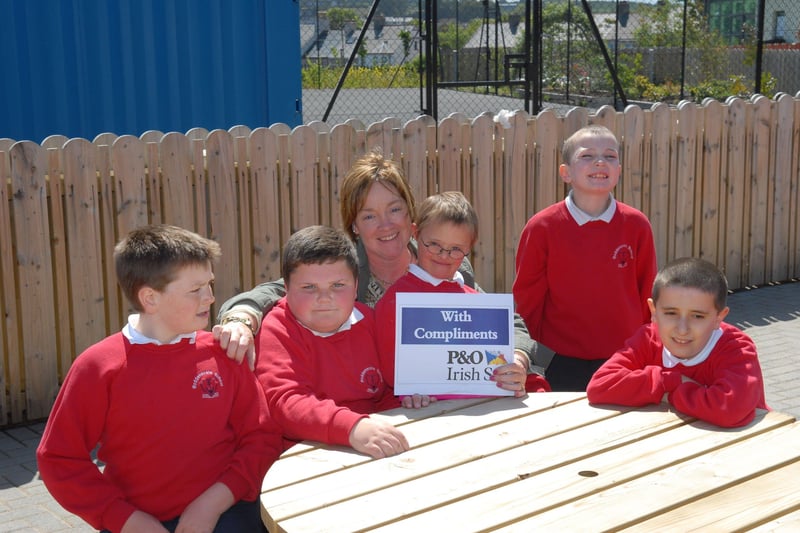 Mary Houston was the winner of the Roddensvale School ballot drawn at the school fete in 2007. She is pictured receiving her prize of a P&O Irish Sea return trip for a car and two from some Class 3 pupils.