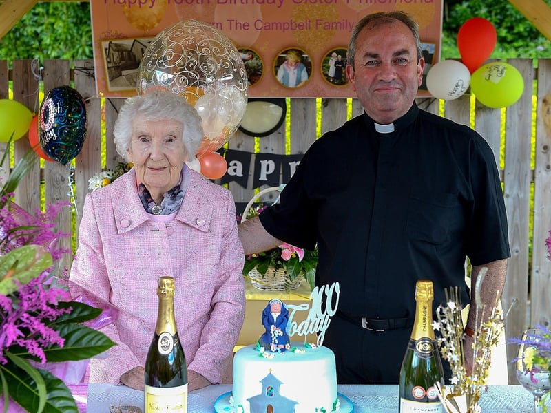 Sr. Philomena Donaghey who celebrated her 100th birthday at Nazareth House Fahan yesterday afternoon pictured with the Very Rev Francis Bradley PP., Buncrana. Photos: George Sweeney. DER2122GS – 051