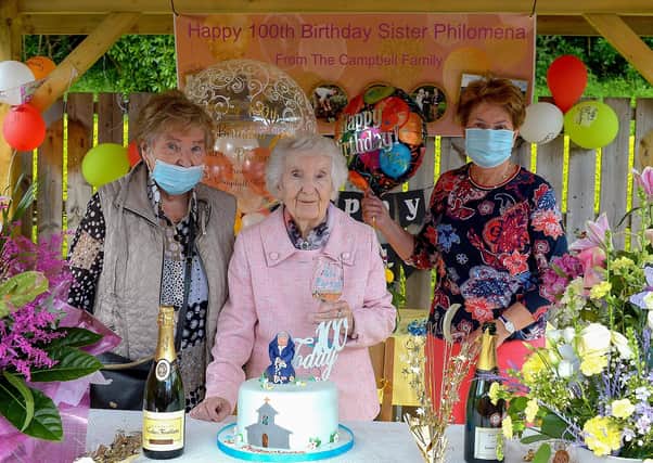 Sr. Philomena Donaghey who celebrated her 100th birthday at Nazareth House Fahan yesterday afternoon pictured with relatives.  DER2122GS – 054