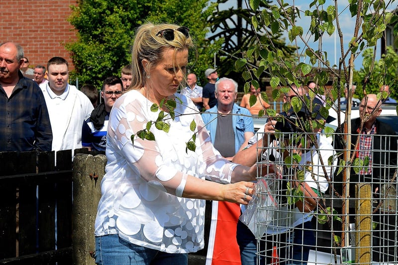 Donna McBrearty, places a memento on the newly planted Crann na Poblachta, at the commemoration for the 1981 hunger strikers and the anniversary of Volunteers George McBrearty and Charles ‘Pop’ Maguire, held at Rathkeele Way on Sunday afternoon last. Photos: George Sweeney.  DER2122GS - 003