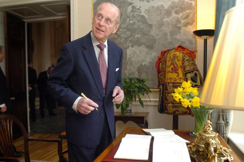 The Duke of Edinburgh signs the visitors book after meeting recipients and guests of the Duke of Edinburgh Award Scheme  at a special reception at Hillsborough Castle as they recieved their Gold Awards. Picture Charles McQuillan/Pacemaker.
