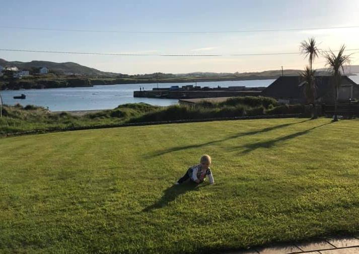 Sue Lynn - playing in the garden by the sea