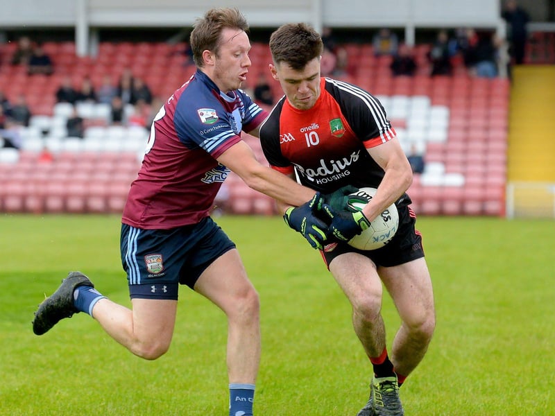 Sean Dolans Caolan McCosker battles for possession with Glack’s Ryan Morgan during Friday evenings game in Celtic Park. (Photo: George Sweeney)