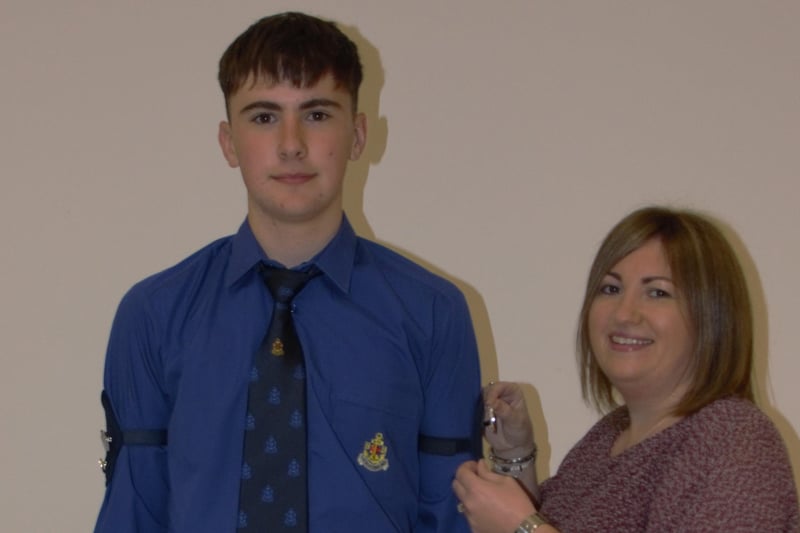 Matthew Keers awarded his Presidents badge by his mum Alison