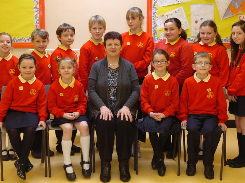 Steelstown Primary School principal Deidre Gillespie with the newly elected student council. Thay are, seated from left, Cara Clifford, Alice McLaughlin, Alice Houston and Jack Hegarty. Standing, from left, Aine O'Hagan, Ethan McLaughlin, Daibhid McGrellis, Joel Crumley, Enya O'Doherty, Saoirse Peoples, Aine Meehan and Emer Barr. (2910PG03)