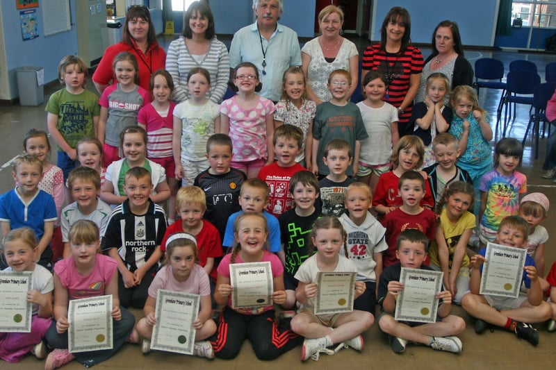 Greenhaw PS P3 pupils who received their Paired Reading Certificates at the school this week. At back are teachers and classroom assistants. 1106JM43