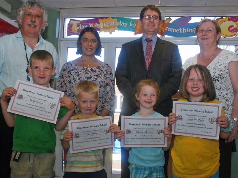 Group pictured before the presentation of Paired Reading and Paired Maths certificates at Greenhaw PS this week. Back from left, Robert McLaughlin, literacy co-ordinator, Vindi Torney, school principal, Brian Keys, Head of Maths, St. Columb's College, who presented the certificates and Eithne O'Doherty, maths co-ordinator. At front are pupils, Brandon, Anthony, Ellie and Jessica. 1106JM45