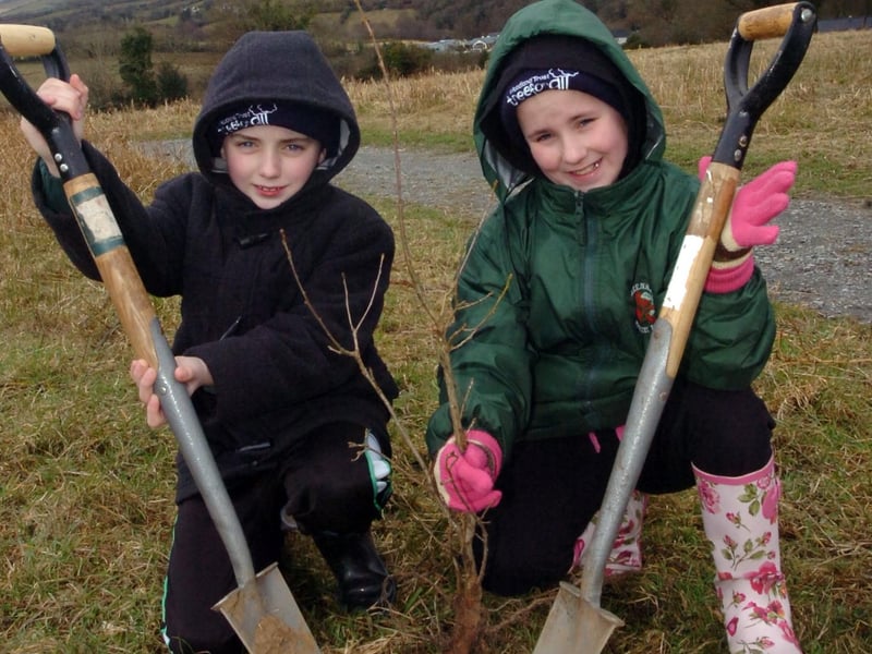 Matthew Wells and Rebecca Wray from Greenhaw Primary School planting a tree at Burntollet Woods as part of the Woodland Trust 'Tree for All' campaign. (2303PG04)