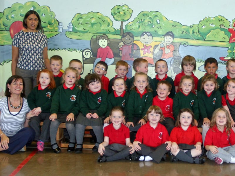 The Primary 1 class at Greenhaw PS, Carnhill. On left is, Mrs. Torney, school principal, Mrs. Monk, Special Needs Assistant, and on right, Ms. Wilkinson, classroom assistant and Ms. Wilson, teacher. 3009JM11