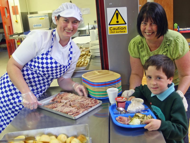 ALLERGIES AWARENESS WEEK!. . . .Oakgrove Primary School P2 pupil Oisin Reynolds being served lunch at the school yesterday by Helen McArthur, cook/supervisor, to highlight Allergies Awareness Week. On right is MaryWray, canteen supervisor. 1709JM14