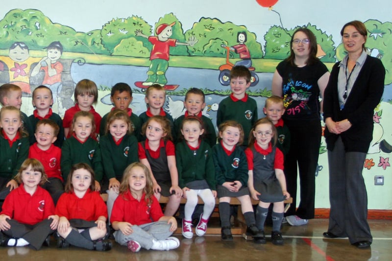 The Primary 1 class at Greenhaw PS, Carnhill. On left is, Mrs. Torney, school principal, Mrs. Monk, Special Needs Assistant, and on right, Ms. Wilkinson, classroom assistant and Ms. Wilson, teacher. 3009JM11