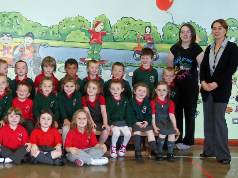 The Primary 1 class at Greenhaw PS, Carnhill. On left is, Mrs. Torney, school principal, Mrs. Monk, Special Needs Assistant, and on right, Ms. Wilkinson, classroom assistant and Ms. Wilson, teacher. 3009JM11