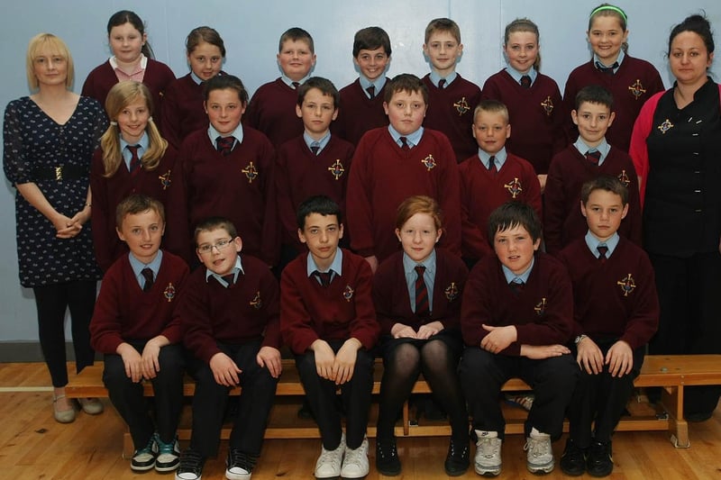 Miss Coyle, left, pictured with her P7 class from St Eithnes Primary School. Also pictured Ms Carr (Classroom Assistant).  1106GM11