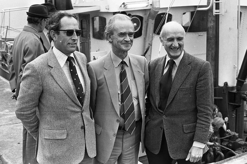Watching the loading of the potatoes are Mr Dan McCormick, DANI inspector, Mr Austen McNeill of Hugh T Barrie and Company, and Mr Frank Espley of the Ulster Farmers' Union pictured  at Warrenpoint harbour at the end of April 1980. Picture: News Letter archives