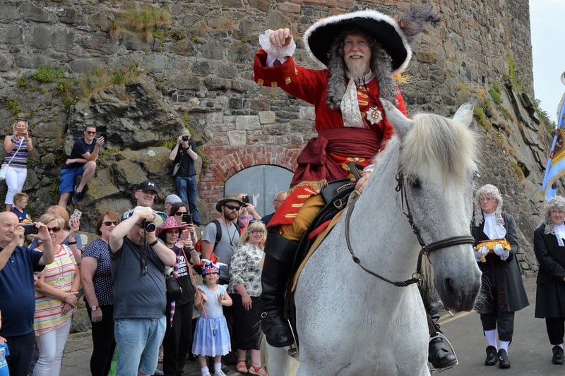 King William III waves to the large crowds at the Royal Landing Festival. INCT 24-015-PSB