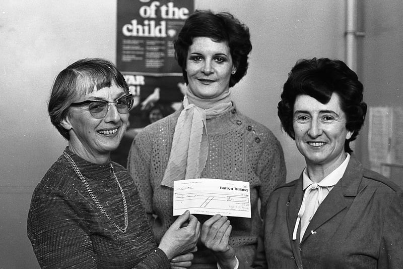 Pictured in May 1981 are Mrs Irene Carson, right, chairman of Women Together, who handed over a cheque to Miss Betty Irwin, administration director with the Northern Ireland Hospice, towards the proposed new hospice at the Antrim Road, Belfast. Included is Miss Eveline O'Rourke, secretary of Women Together. Picture: News Letter archives