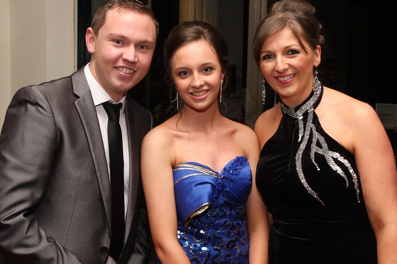 School teacher Rita Mullan (right), with students Gary Hetherington and Laura Canning, arriving for the Lisneal College annual formal dinner in the Everglades Hotel.  INLS 1248-511MT.