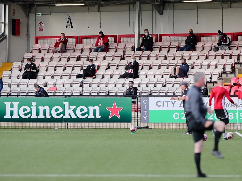 Supporters watch intently as the Derry players go through their warm-ups.