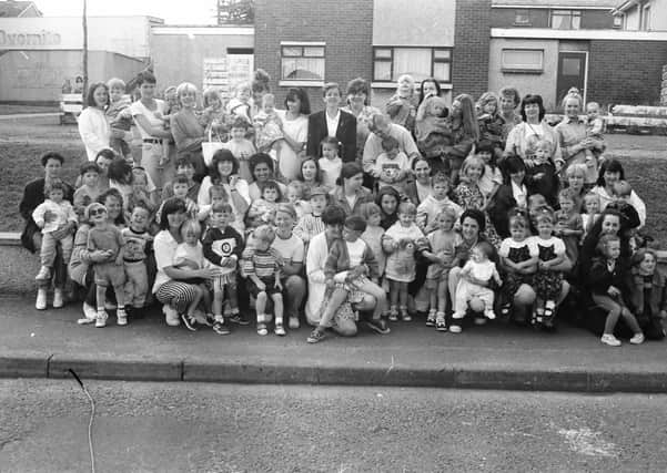 Parents and toddlers of the Top of the Hill community playgroup and the Derryview playgroup before leaving on a bus trip to Portrush.