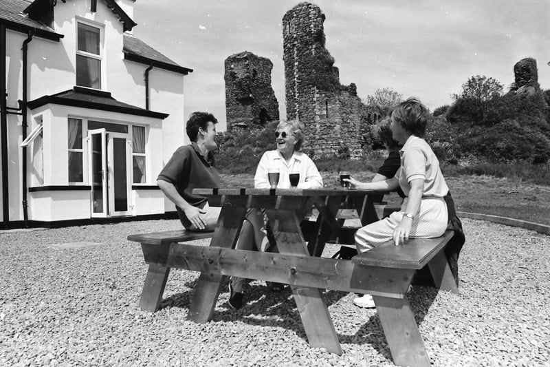 Patrons enjoy refreshments in the dramatic setting of the ancient ruins of Northburg Castle at the Castle Inn.