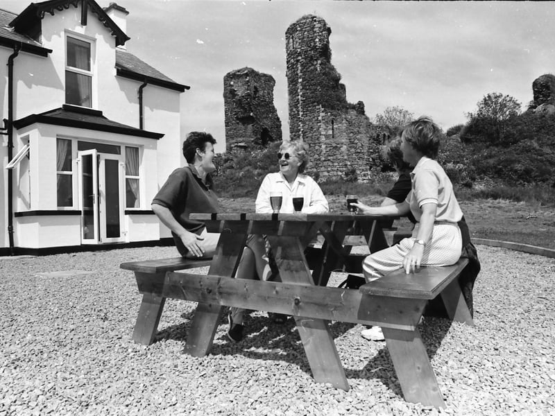 Patrons enjoy refreshments in the dramatic setting of the ancient ruins of Northburg Castle at the Castle Inn.