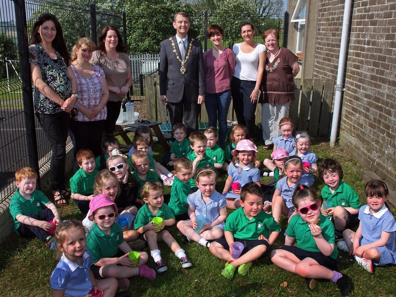 The Mayor of Derry Alderman Maurice Devenney, pictured with P1 pupils and staff on his courtesy visit to St.Colmcille’s primary school, Claudy.