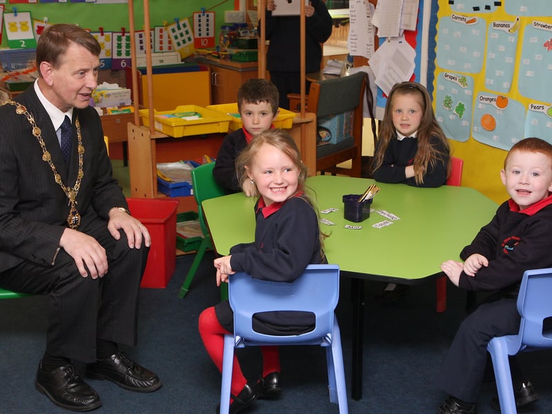 The Mayor of Derry Alderman Maurice Devenney, on his courtesy visit to St. Oliver Plunkett primary school, Strathfoyle, talking with pupils in class P1.