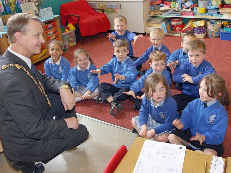 The Mayor of Derry Alderman Maurice Devenney, listening to stories from P1 pupils during his courtesy visit Nazareth House primary school.