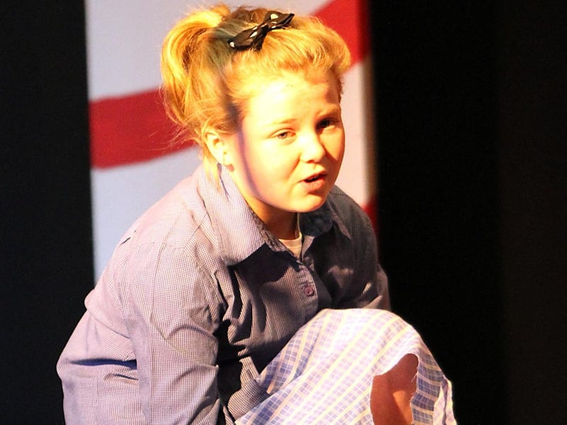 Cinderlla played by Sonia McAleese trys on he glass shoe in Ballykelly Primary Schools Christmas Play, Pandemonium. INLV5012-109KDR