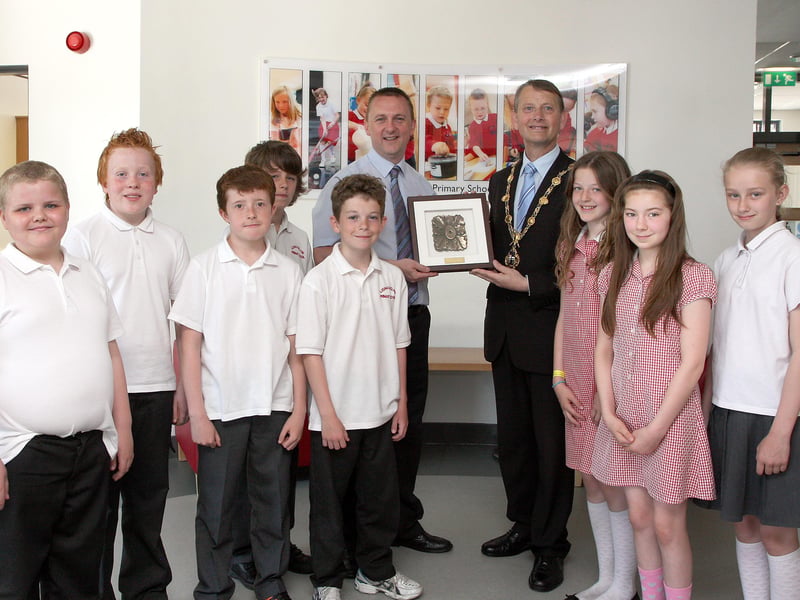 The Mayor of Derry Alderman Maurice Devenney, presents a special Civic gift to principal Colin Torrens, during his courtesy visit to Lisnagelvin primary school.