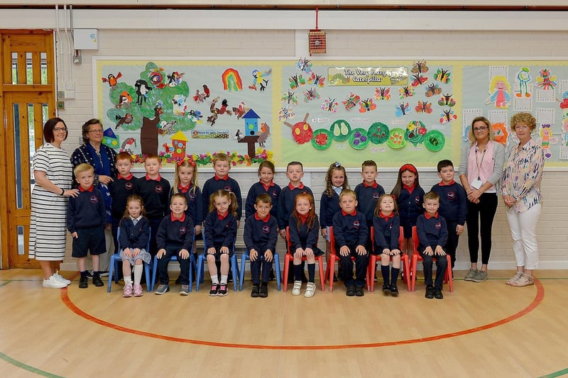 Mrs K. McKinney, second from right, pictured with St Oliver Plunkett Primary School’s P1 class and classroom assistants.  DER2123GS – 023