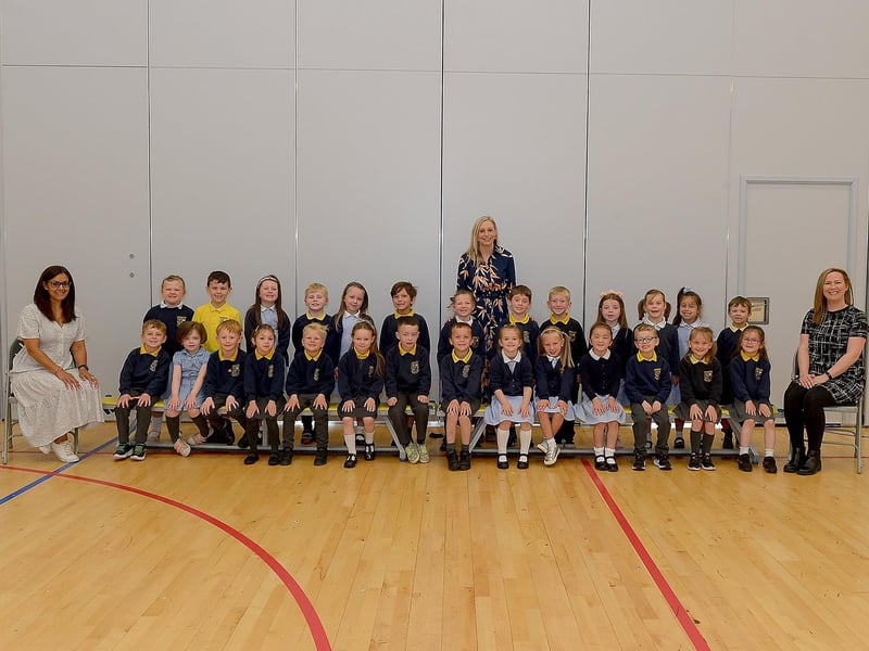 Miss Jaguta, Mrs Baggley and Miss Moore pictured with their P1 class at Ebrington Primary School, Derry. DER2123GS – 012