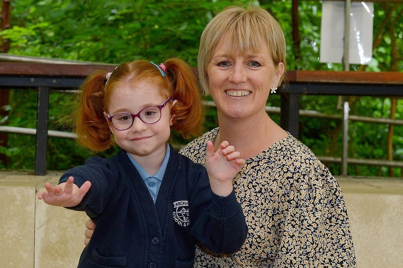 P1 pupil Ava Harkin pictured with Special Needs Assistant Ms Alison Henderson at Ardnashee Primary School, Derry. DER2124GS – 007