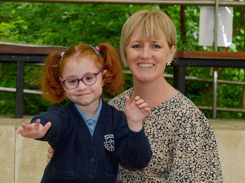 P1 pupil Ava Harkin pictured with Special Needs Assistant Ms Alison Henderson at Ardnashee Primary School, Derry. DER2124GS – 007